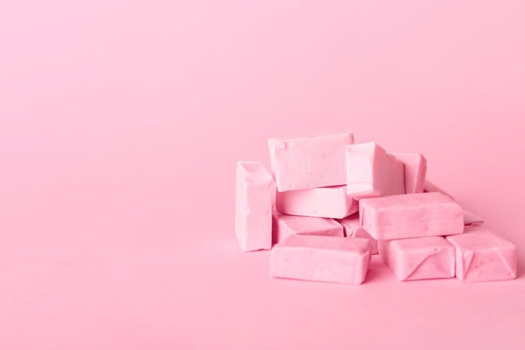 Pink calcium citrate chews with a pink background